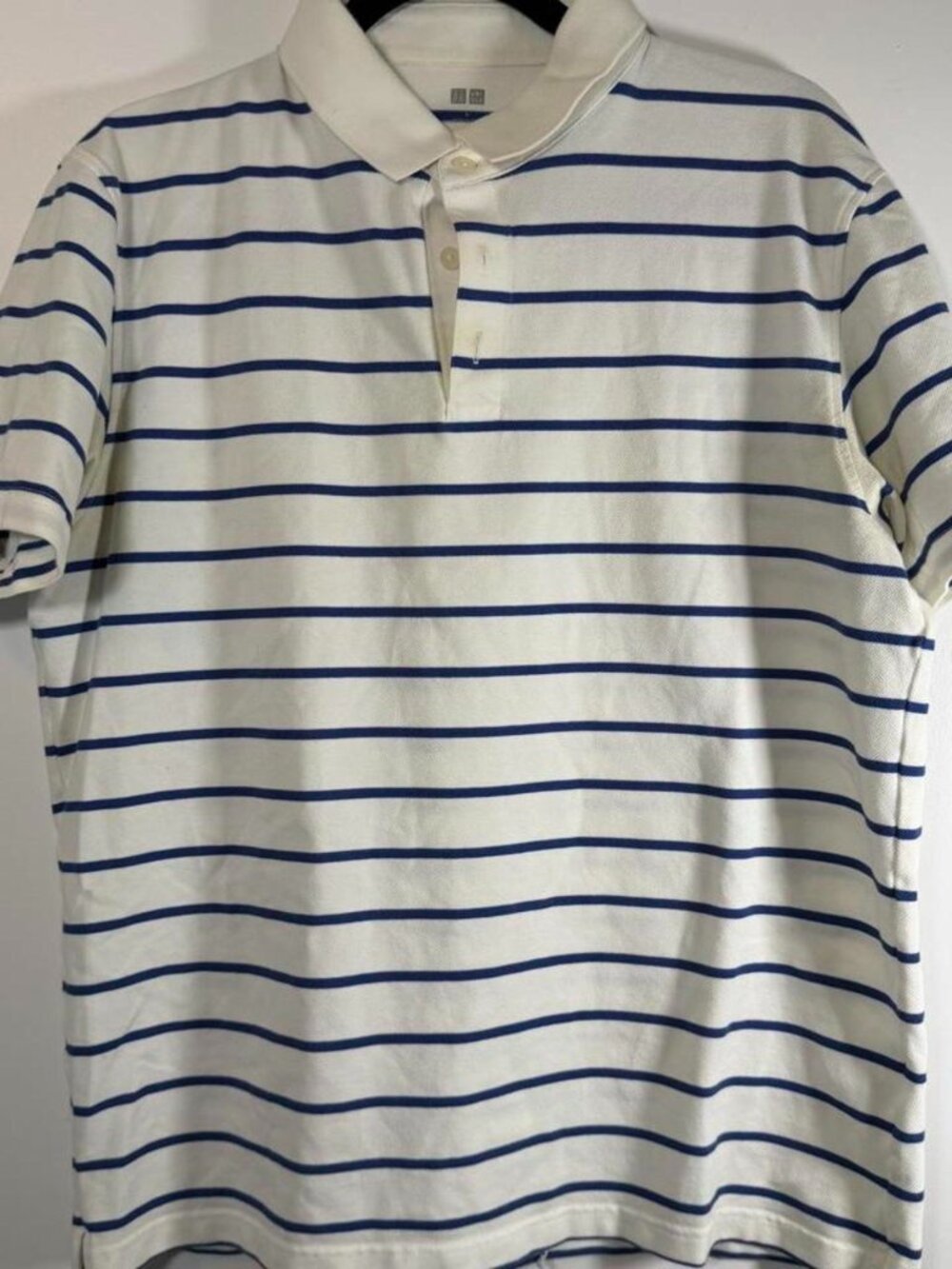 Uniqlo white and blue striped polo shirt in size L